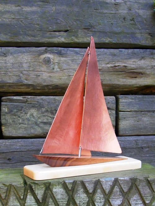 Wavecrest II  - limited edition Copper and Stainless Steel Yacht Model with Copper Sails on a Port Tack This stylized Yacht Design has a Walnut Hull with tiger stripe detail running through the timber,  sitting on on a Maple base.