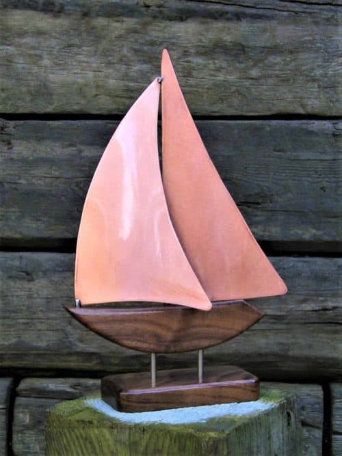 Zanzibar XXV is a Limited Edition Yacht Model handmade with a Brushed Copper Main & Headsail on a Starboard tack