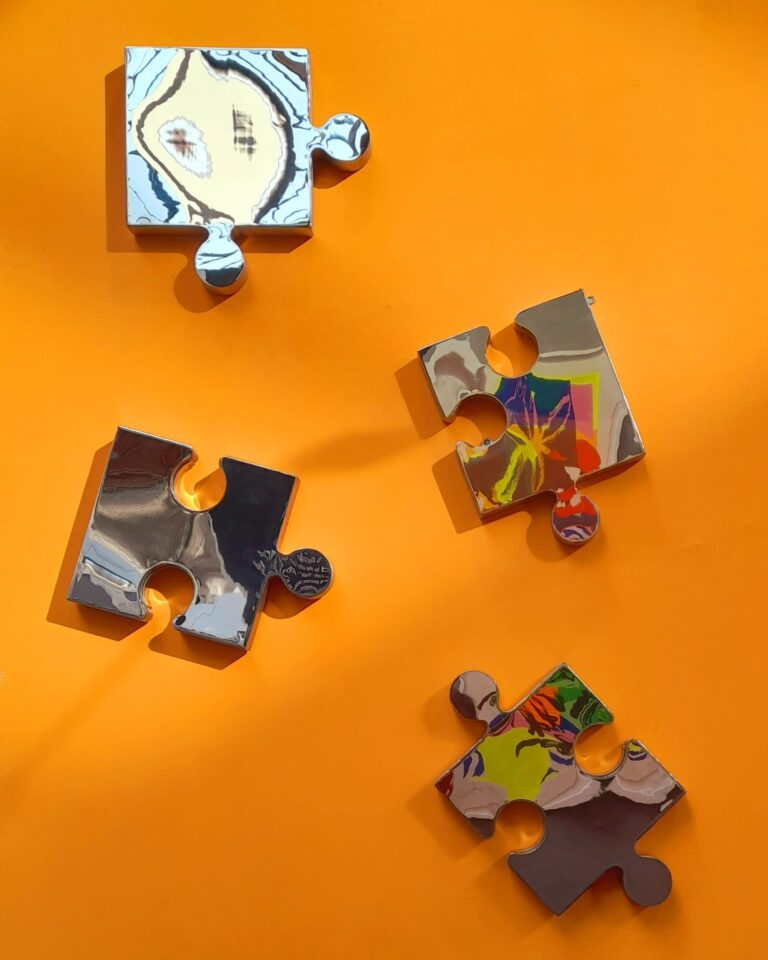 Puzzling - Stainless Steel Sculpture by Grant Designs inspired by the fun of making Jigsaws.